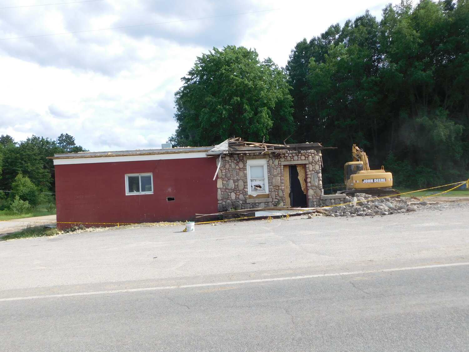 These photos show the demolition of the old Hamilton Township Hall in progress and at completion. Note the corner location of the standing water spout prior to demo.
